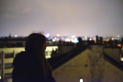 Defocused image of illuminated city at night