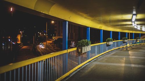 Elevated walkway over street at night