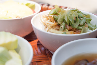 Close-up of salad and soup in bowls on table