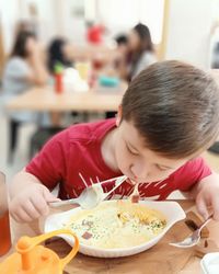 Midsection of woman eating food