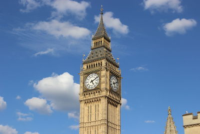 Low angle view of clock tower against sky