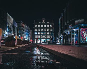 Belfast bank buildings. primark glows on its reopening day.