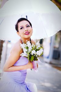 Portrait of a girl holding flower