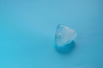 Close-up of blue water on white background