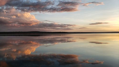 Scenic view of lake against sky during sunset
