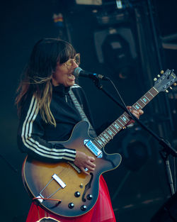 Woman playing guitar