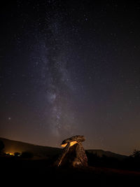 Scenic view of star field against sky at night