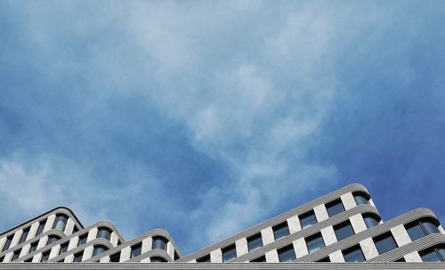 Low angle view of building against cloudy sky