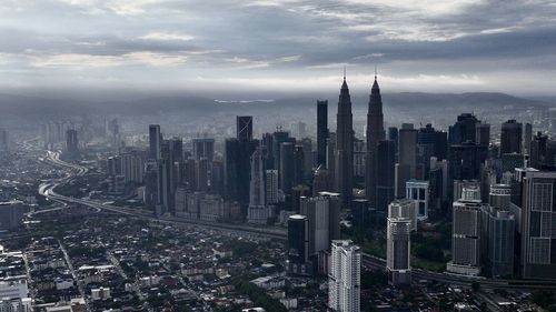 Aerial view of cityscape against sky