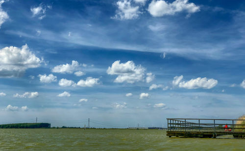 Bridge over sea against sky