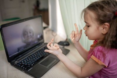 Side view of woman talking on video call