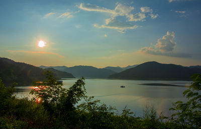 Scenic view of lake against sky during sunset