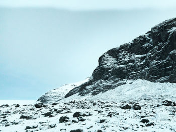 Scenic view of snowcapped mountain against sky