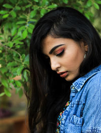 Close-up of young woman looking down