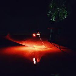 Low angle view of illuminated lights at night