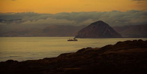 Scenic view of sea against cloudy sky