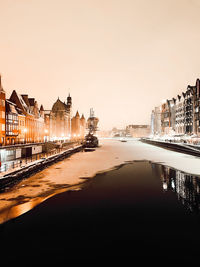 Illuminated buildings in city at night