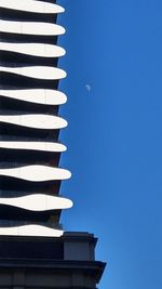 Low angle view of pagoda against clear blue sky