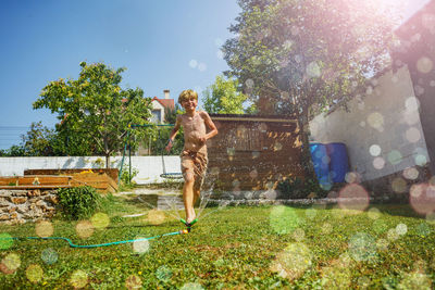 Full length of woman standing on field