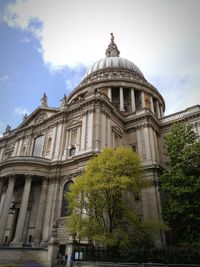 Low angle view of historical building against cloudy sky