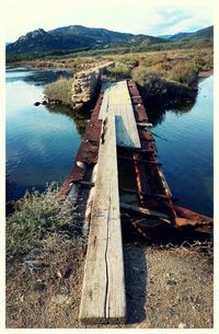 View of built structure by lake