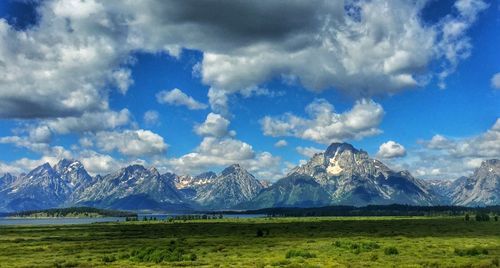 Scenic view of landscape against cloudy sky