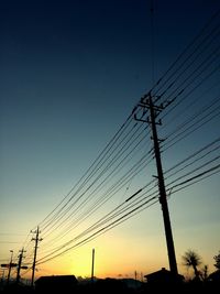 Low angle view of electricity pylon against sky