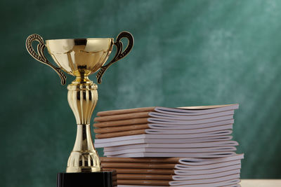 Close-up of trophy by books