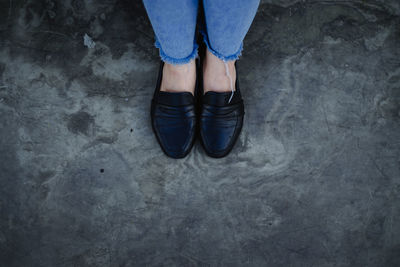 Low section of man standing on floor