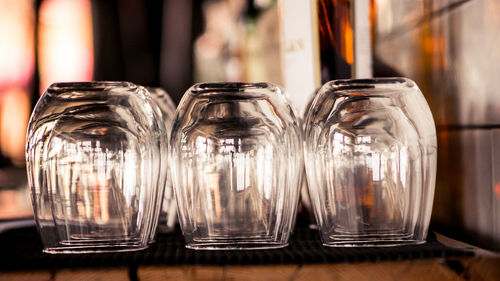 Close-up of wine glasses on table