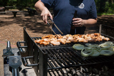 Man preparing food in cooking pan