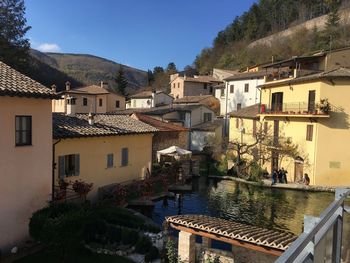 Buildings in town against sky