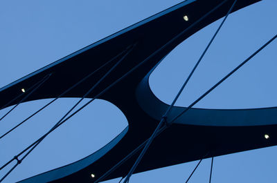 Low angle view of bridge against clear blue sky