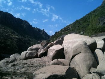 Rocks on mountain against sky