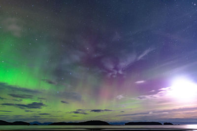 Scenic view of sea against sky at night