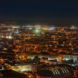 High angle view of illuminated city buildings at night