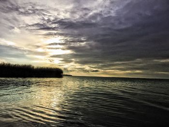 Scenic view of sea against cloudy sky