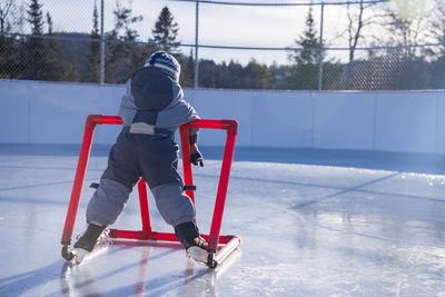 Low section of person skiing on snow