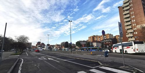 City street and buildings against sky