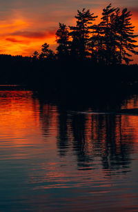 Scenic view of lake at sunset