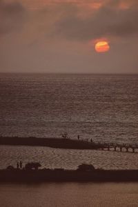 Scenic view of sea at sunset