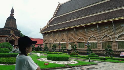 Woman standing in front of temple