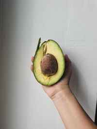 Midsection of person holding apple