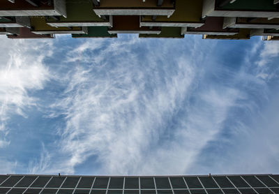 Low angle view of electricity pylon against sky