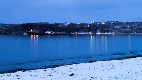 Scenic view of frozen lake against sky during winter