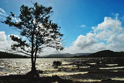 Scenic view of sea against cloudy sky