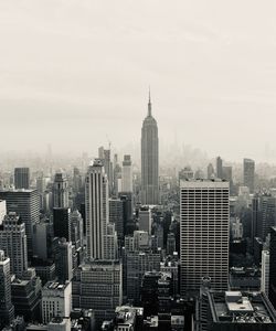 Modern buildings in city against sky