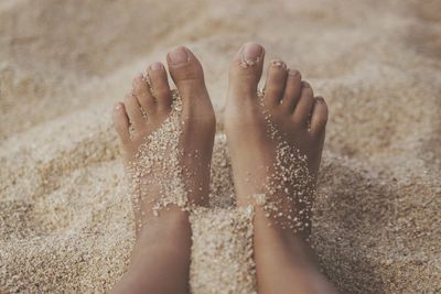 Low section of person on sand