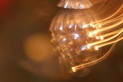 Close-up of illuminated light bulb