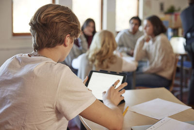 Student using tablet in class